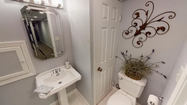 a bathroom with a toilet and a sink