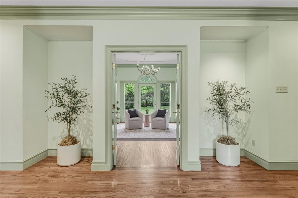 3201 Edward Drive Waco, TX 76708 - Photo 25 of 40 a room with wooden floor and potted plant