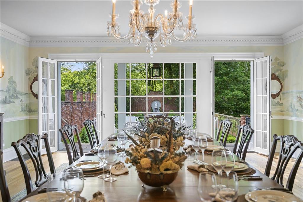 526 Scaife Road Sewickley, PA 15143 - Photo 14 of 50 a view of a dining room with furniture a chandelier and large windows
