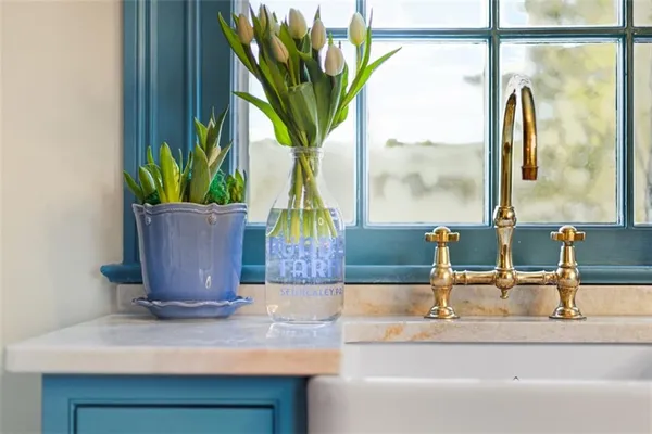 a living room with furniture hard wood floor and a table
