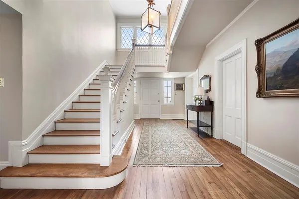 a living room with furniture rug and window