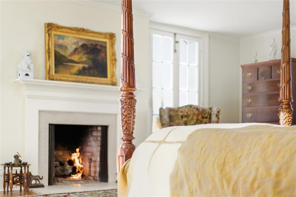 526 Scaife Road Sewickley, PA 15143 - Photo 34 of 50 a bedroom with a bed and a fireplace
