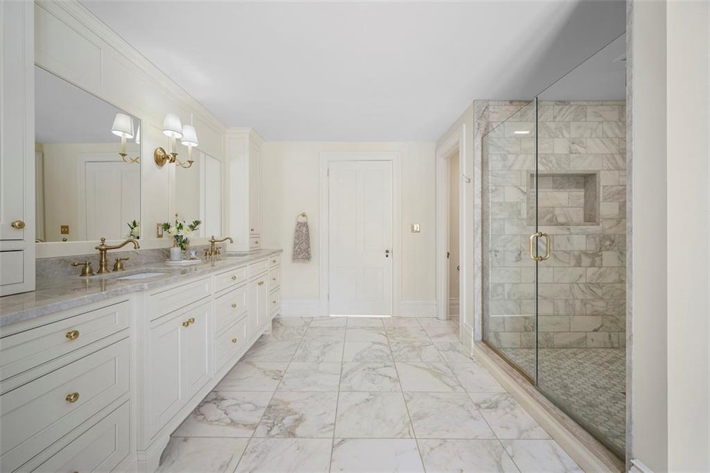 526 Scaife Road Sewickley, PA 15143 - Photo 36 of 50 a bathroom with a granite countertop sink a mirror and a shower