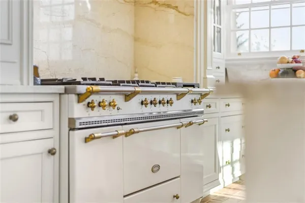 a view of a dining room with furniture and a window