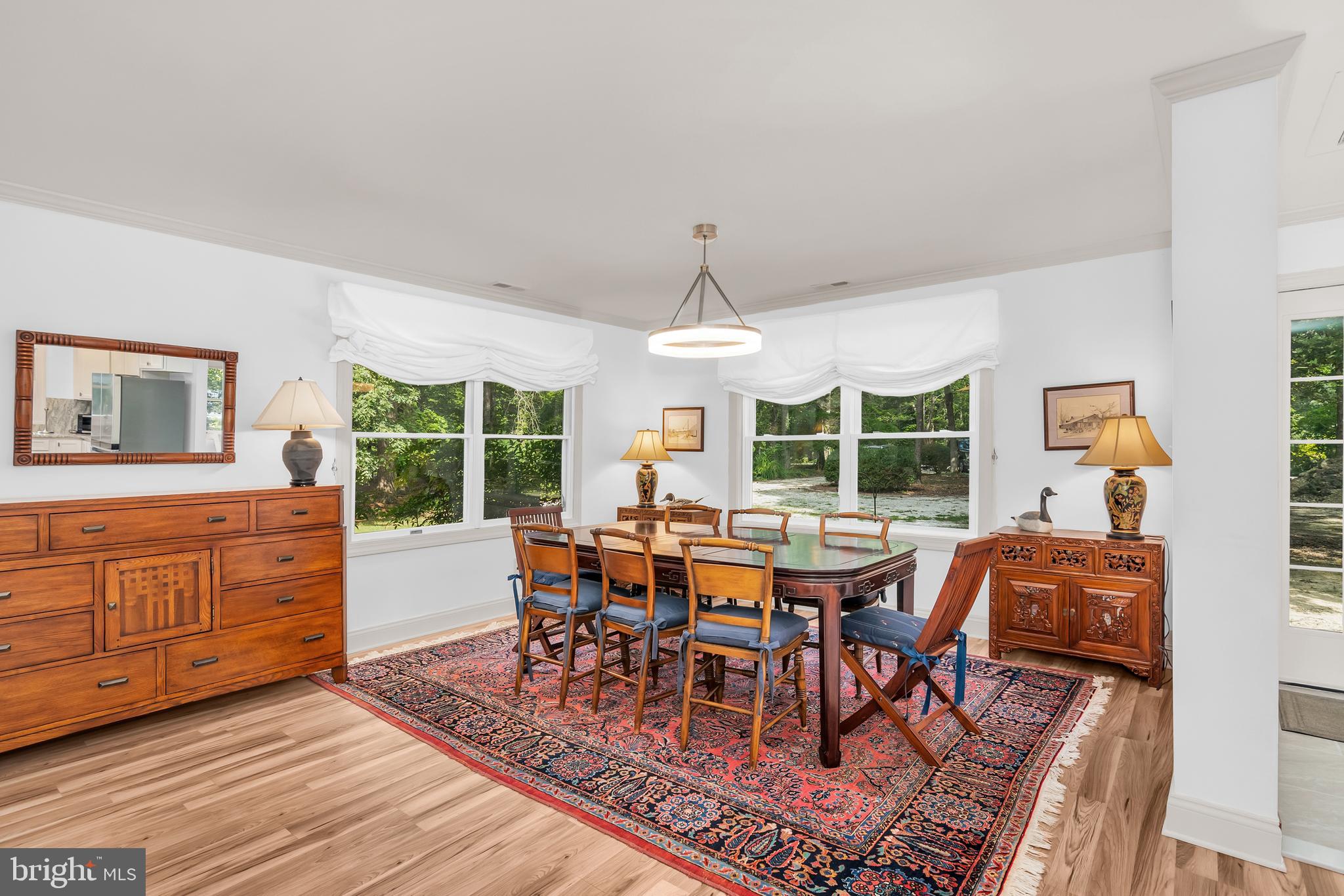 9459 New Road McDaniel, MD 21647 - Photo 12 of 27 a view of a dining room with furniture window and outside view