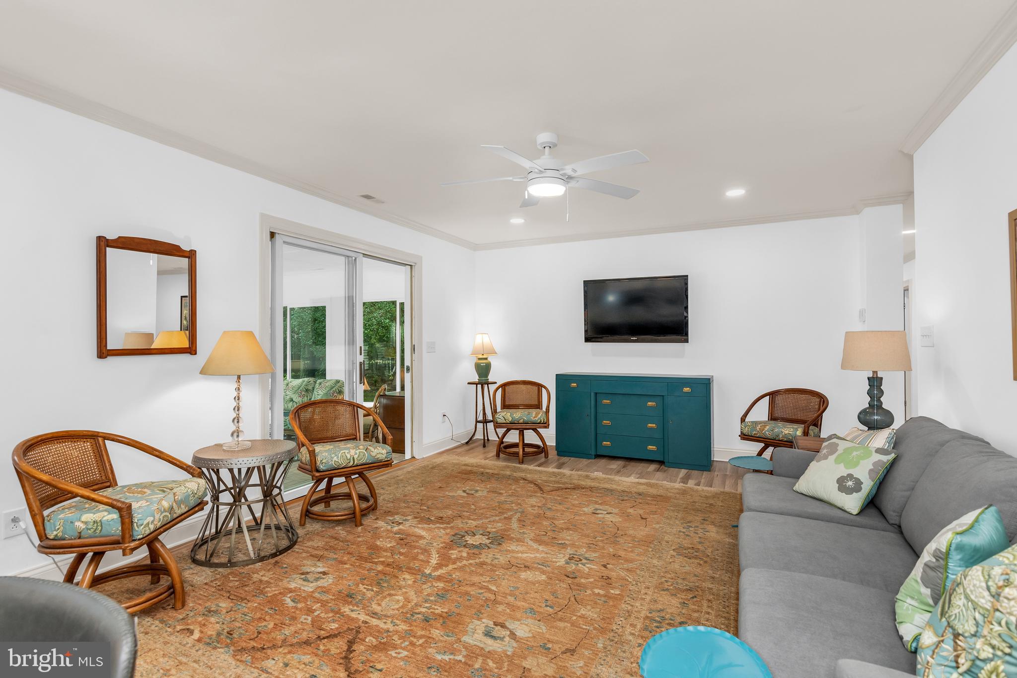 9459 New Road McDaniel, MD 21647 - Photo 16 of 27 a bedroom with furniture and a flat screen tv