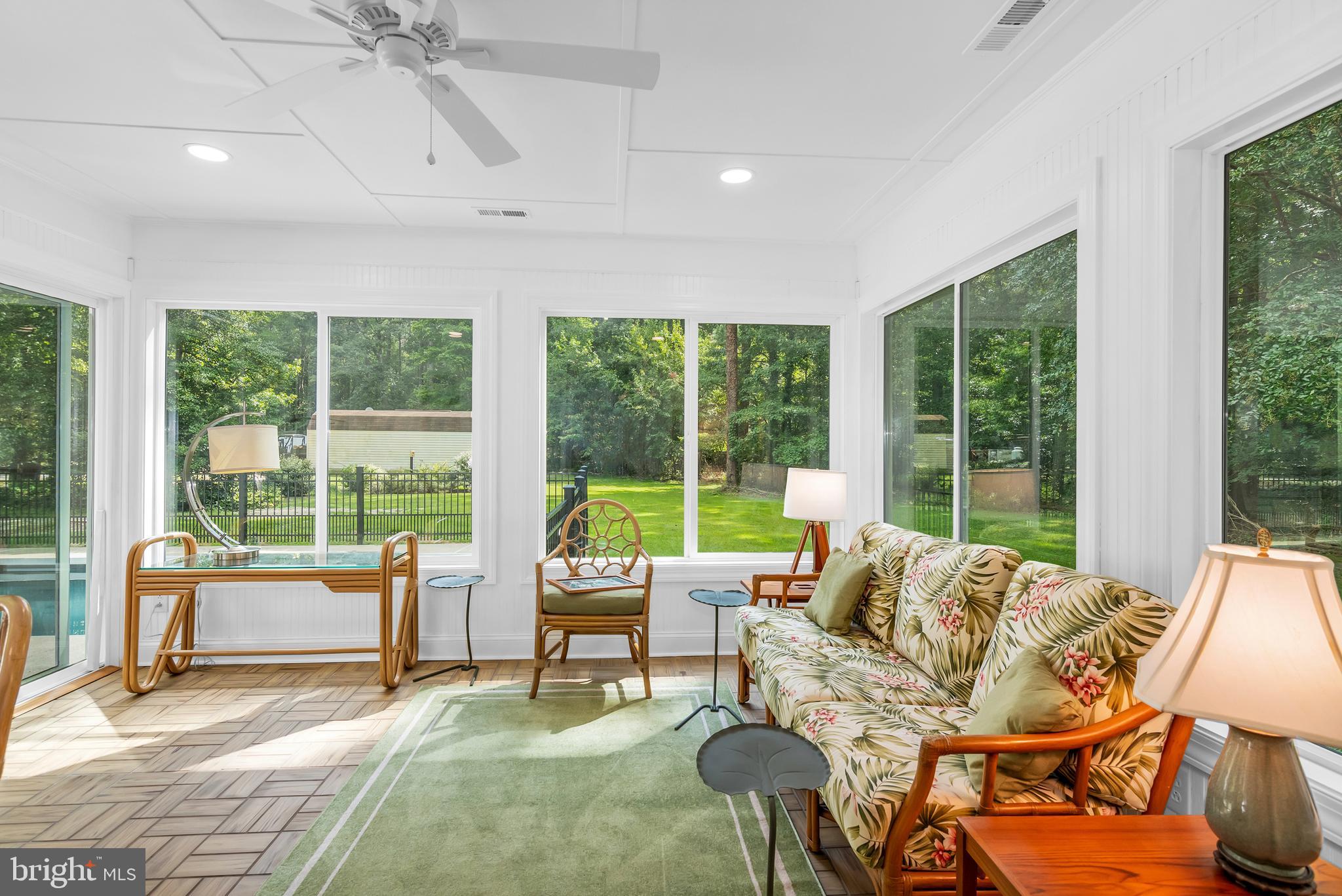 9459 New Road McDaniel, MD 21647 - Photo 19 of 27 a living room with furniture and large windows