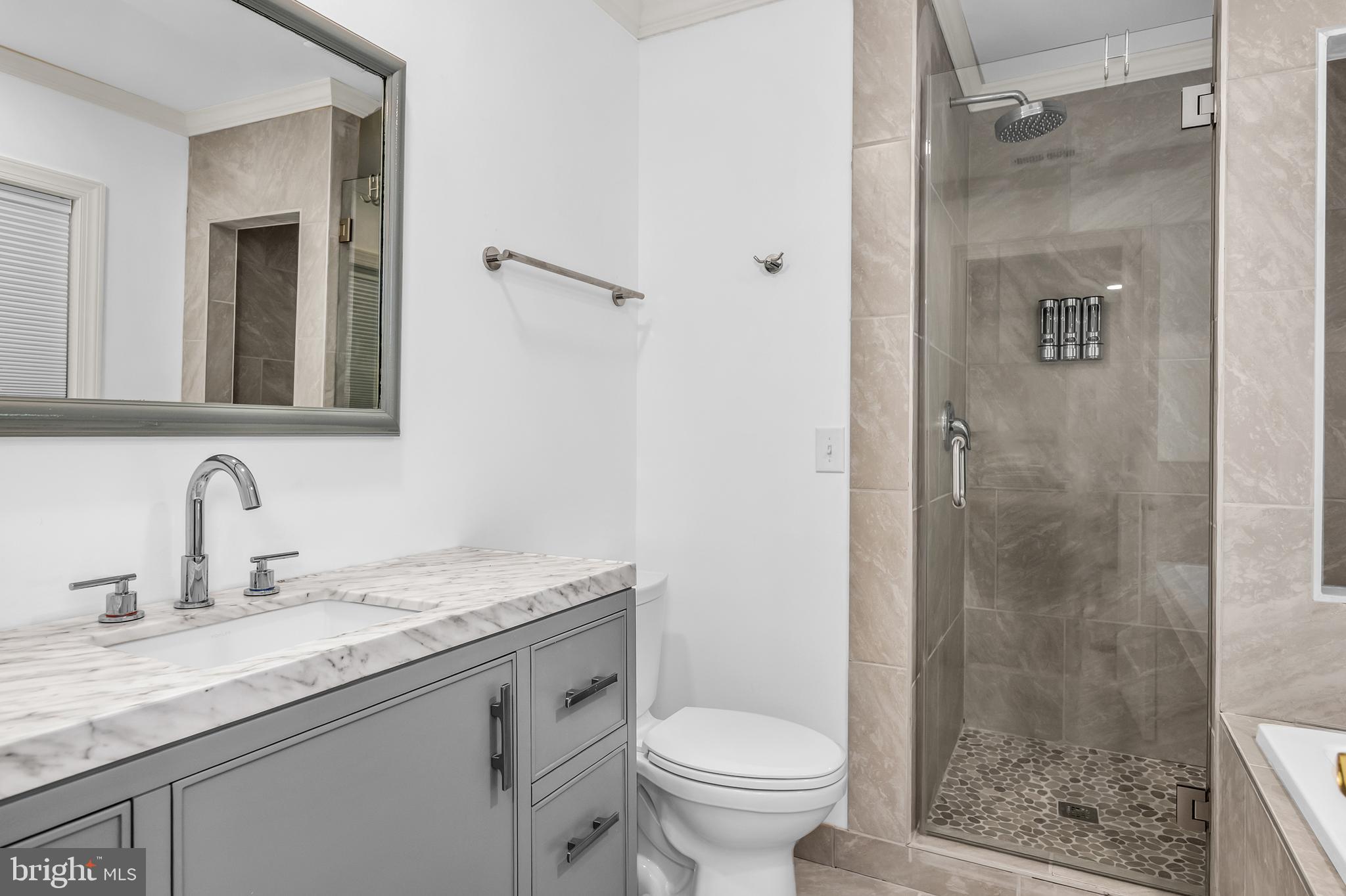 9459 New Road McDaniel, MD 21647 - Photo 25 of 27 a bathroom with a granite countertop sink toilet and shower