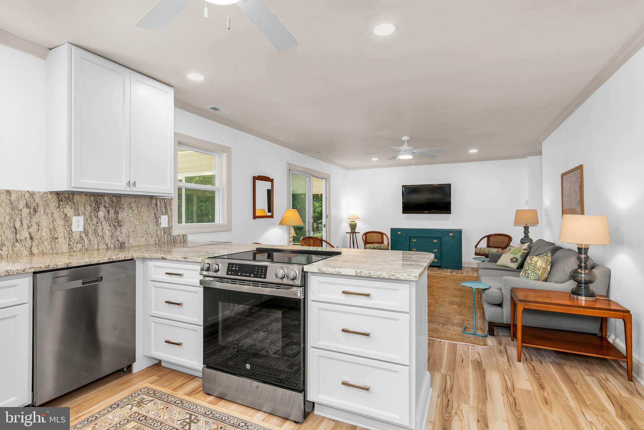 9459 New Road McDaniel, MD 21647 - Photo 8 of 27 a kitchen with a stove oven and a sink