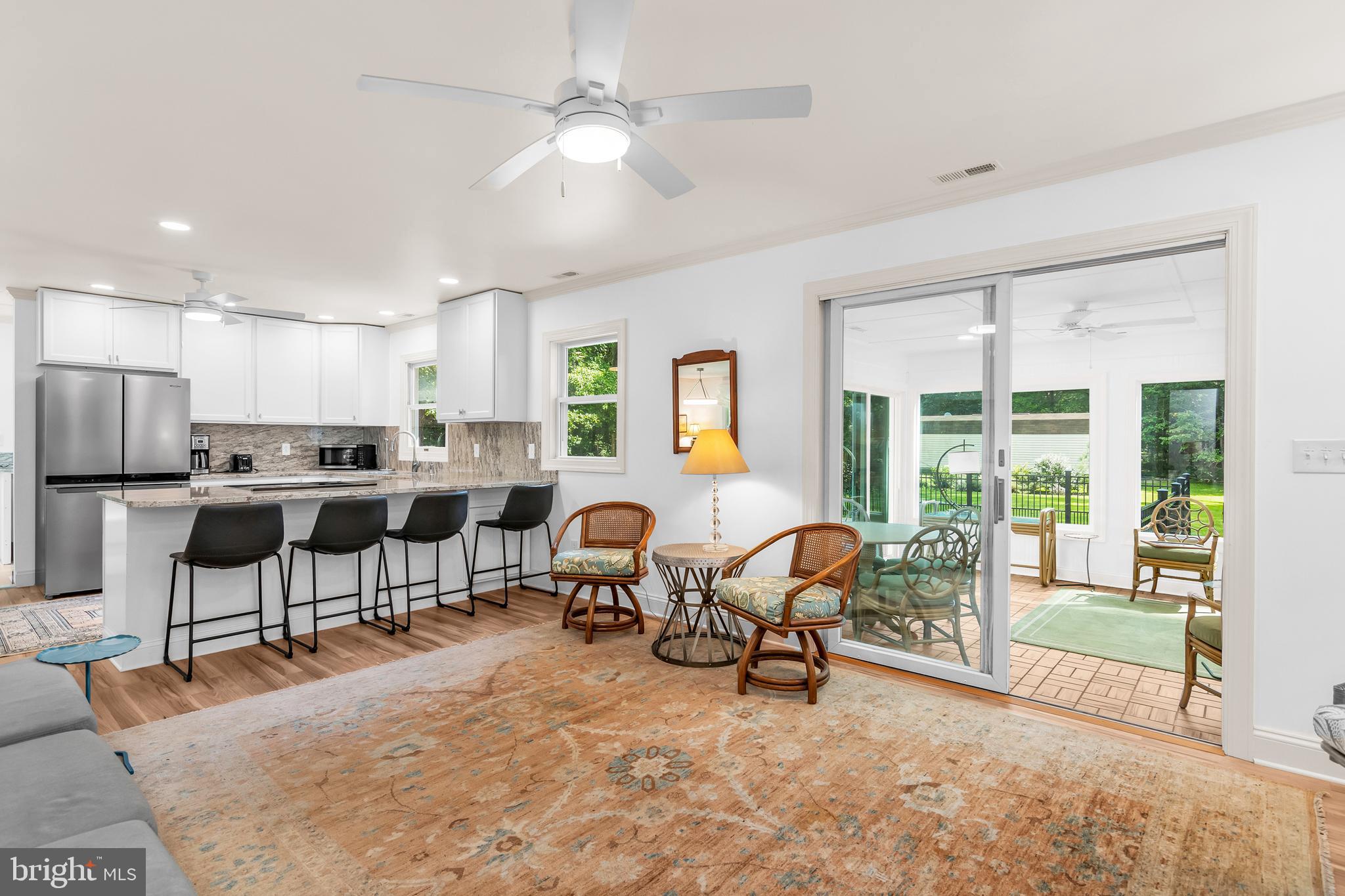 9459 New Road McDaniel, MD 21647 - Photo 9 of 27 a living room kitchen with furniture and a large window