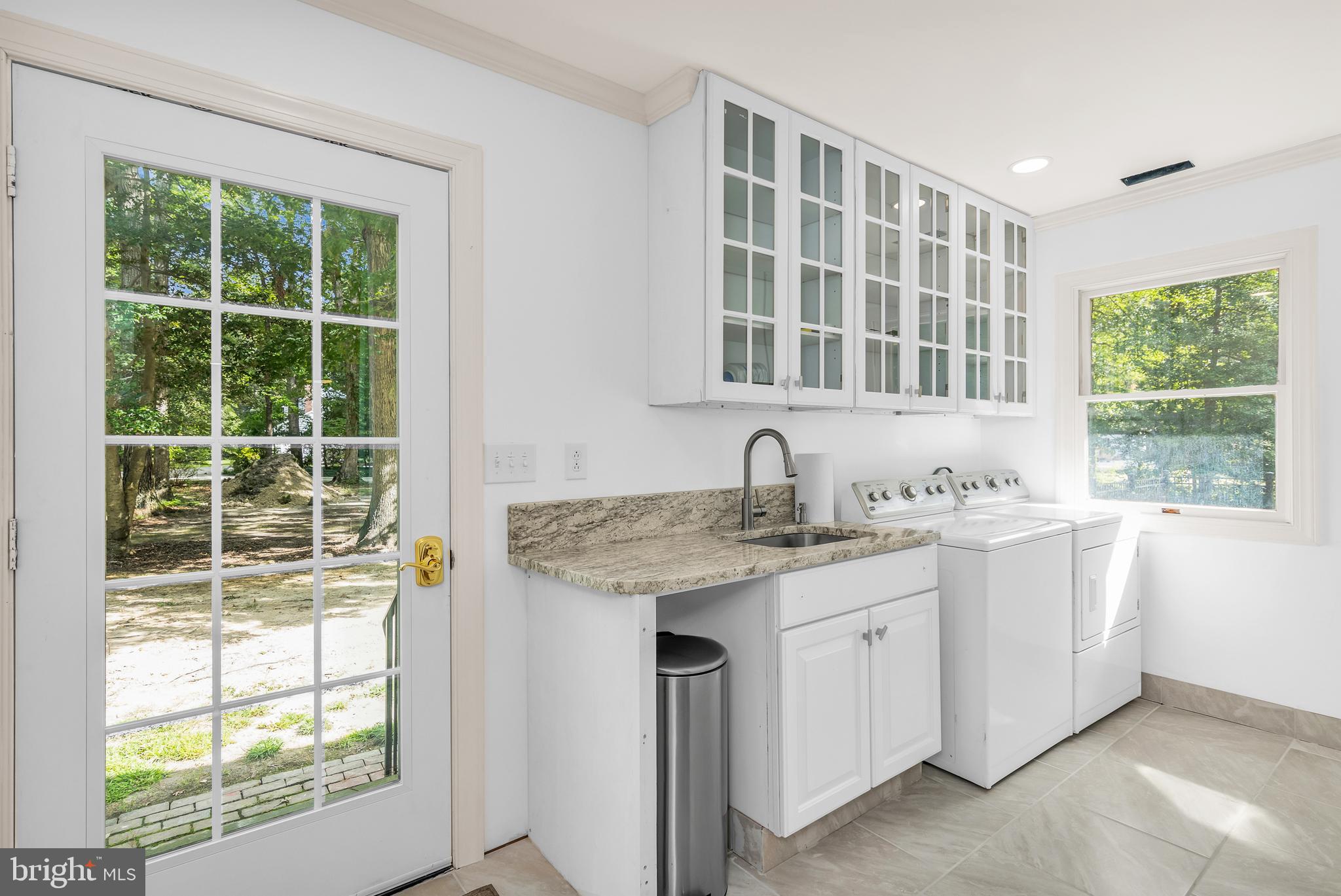 9459 New Road McDaniel, MD 21647 - Photo 10 of 27 a bathroom with a granite countertop sink and mirror