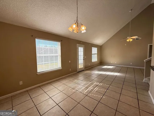 a view of a kitchen with granite countertop cabinets