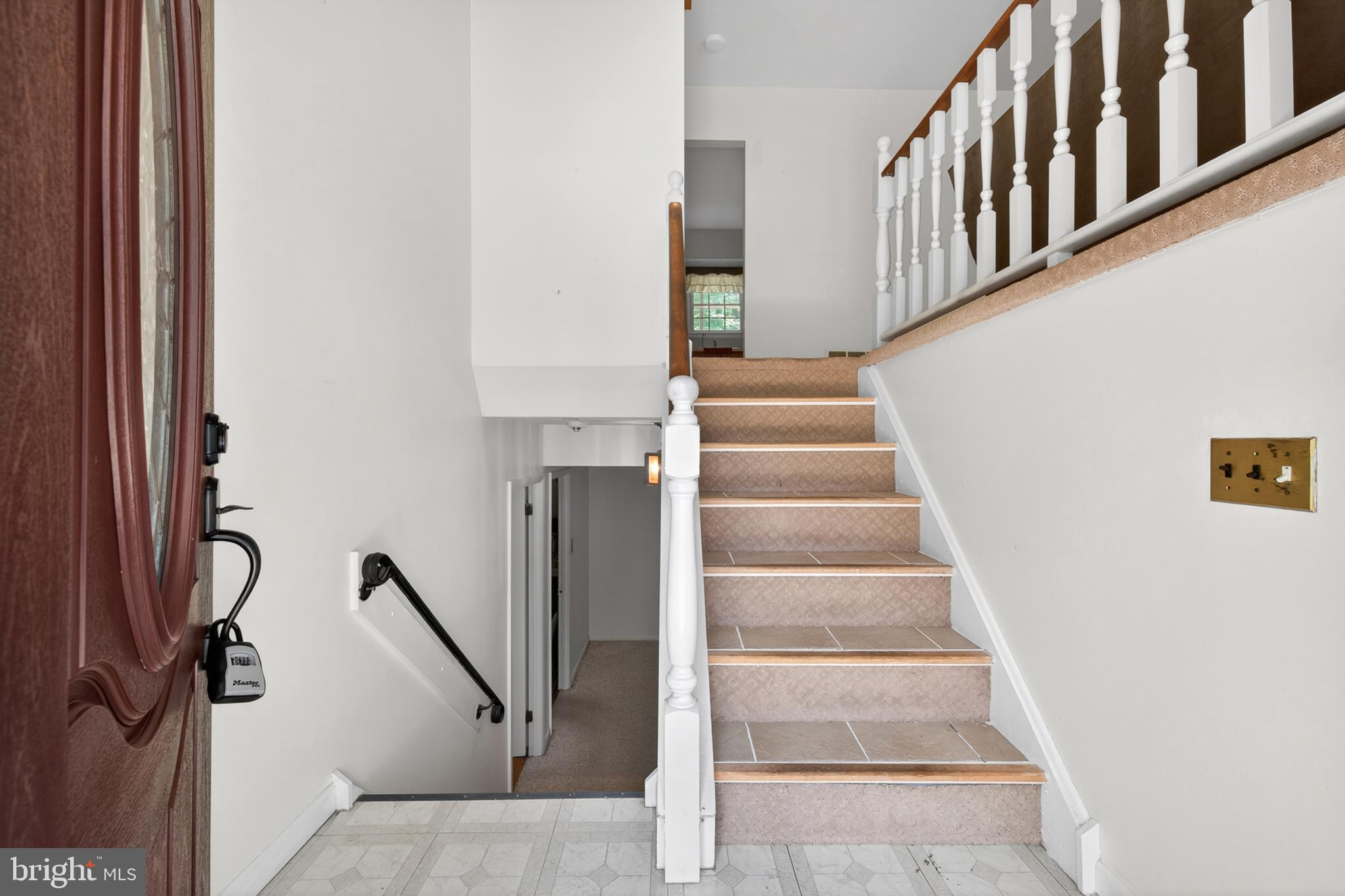3701 Ebright Road Chadds Ford, PA 19317 - Photo 33 of 45 a view of staircase with lots of frames on wall