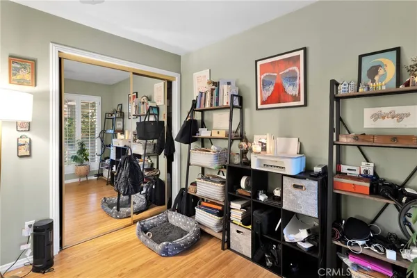 a spacious bedroom with a bed and a chandelier
