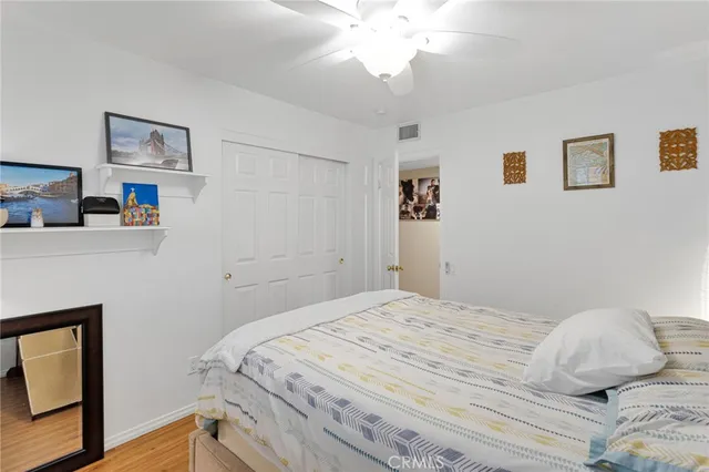 a bedroom with a large bed and a large window