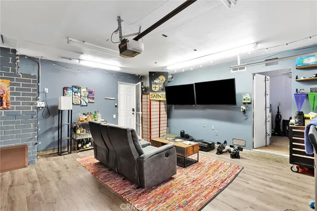 a view of swimming pool with outdoor seating and plants