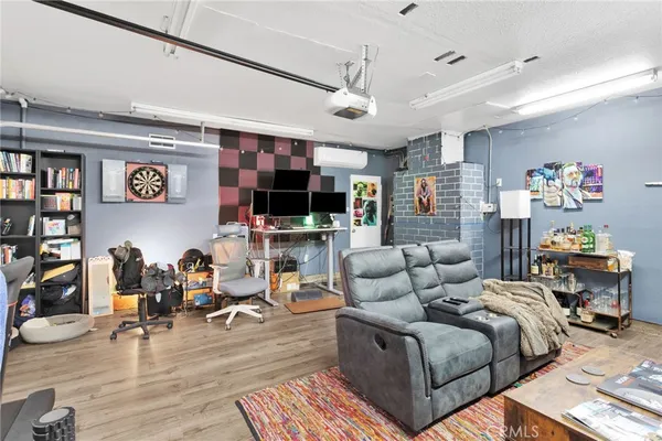 a view of swimming pool with sitting area