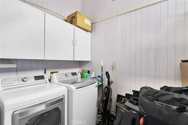 a view of a house with swimming pool and porch with furniture