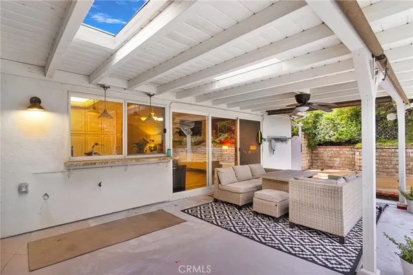 a view of a house with swimming pool and a yard