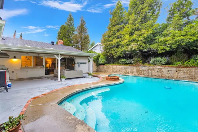 an aerial view of multiple houses with yard