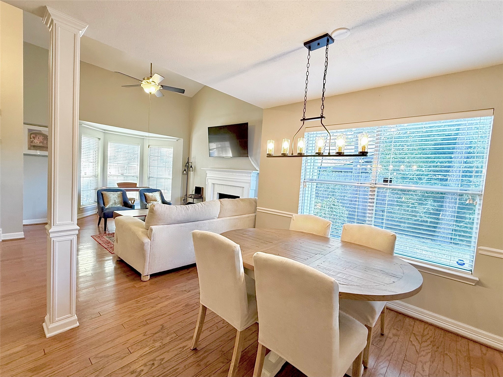 16902 Colony Creek Drive Spring, TX 77379 - Photo 3 of 18 a view of a dining room with furniture window and wooden floor