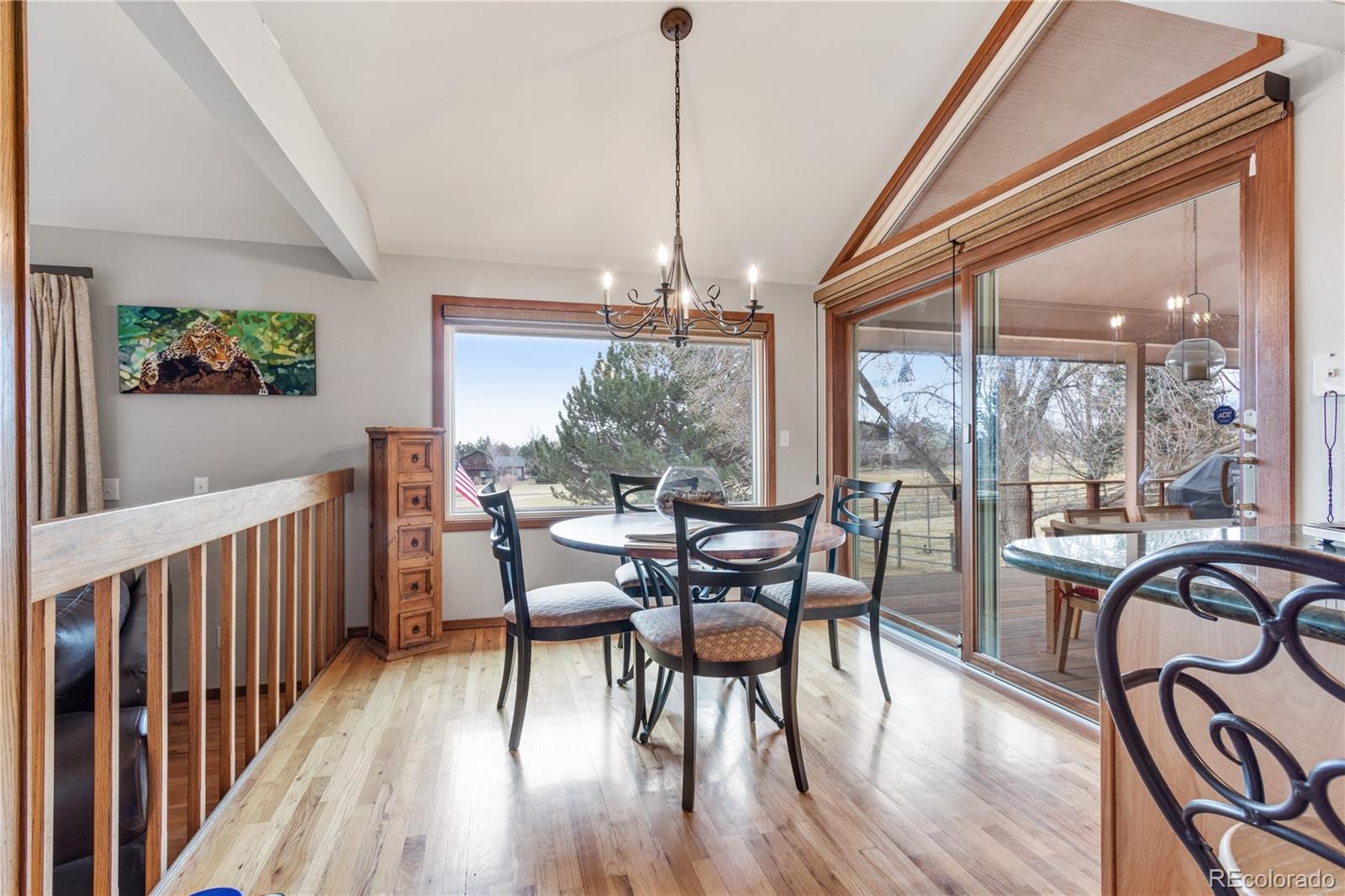 6674 Fairways Drive Longmont, CO 80503 - Photo 12 of 40 a view of a dining room with furniture window and outside view