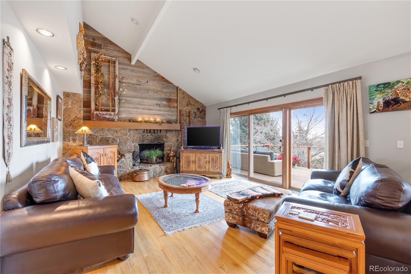 6674 Fairways Drive Longmont, CO 80503 - Photo 13 of 40 a living room with furniture large window and a flat screen tv