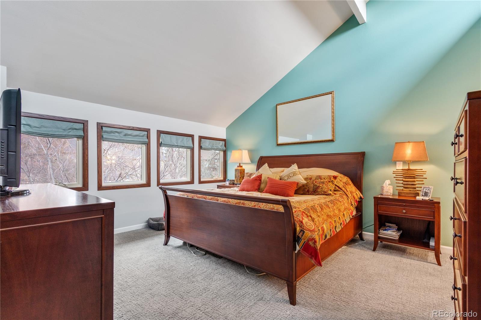 6674 Fairways Drive Longmont, CO 80503 - Photo 18 of 40 a bed room with a bed and a table