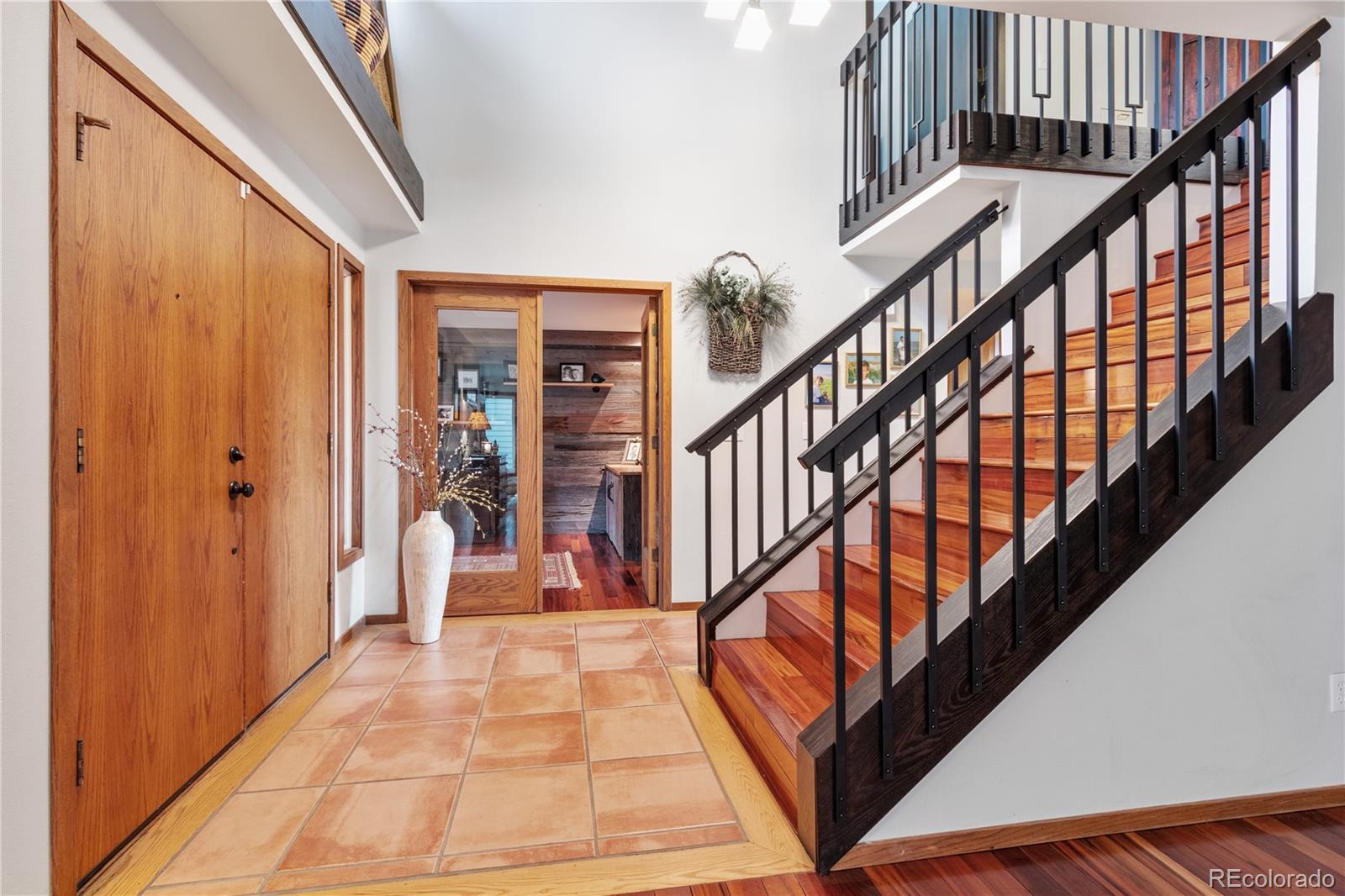 6674 Fairways Drive Longmont, CO 80503 - Photo 2 of 40 a view of an entryway with wooden floor