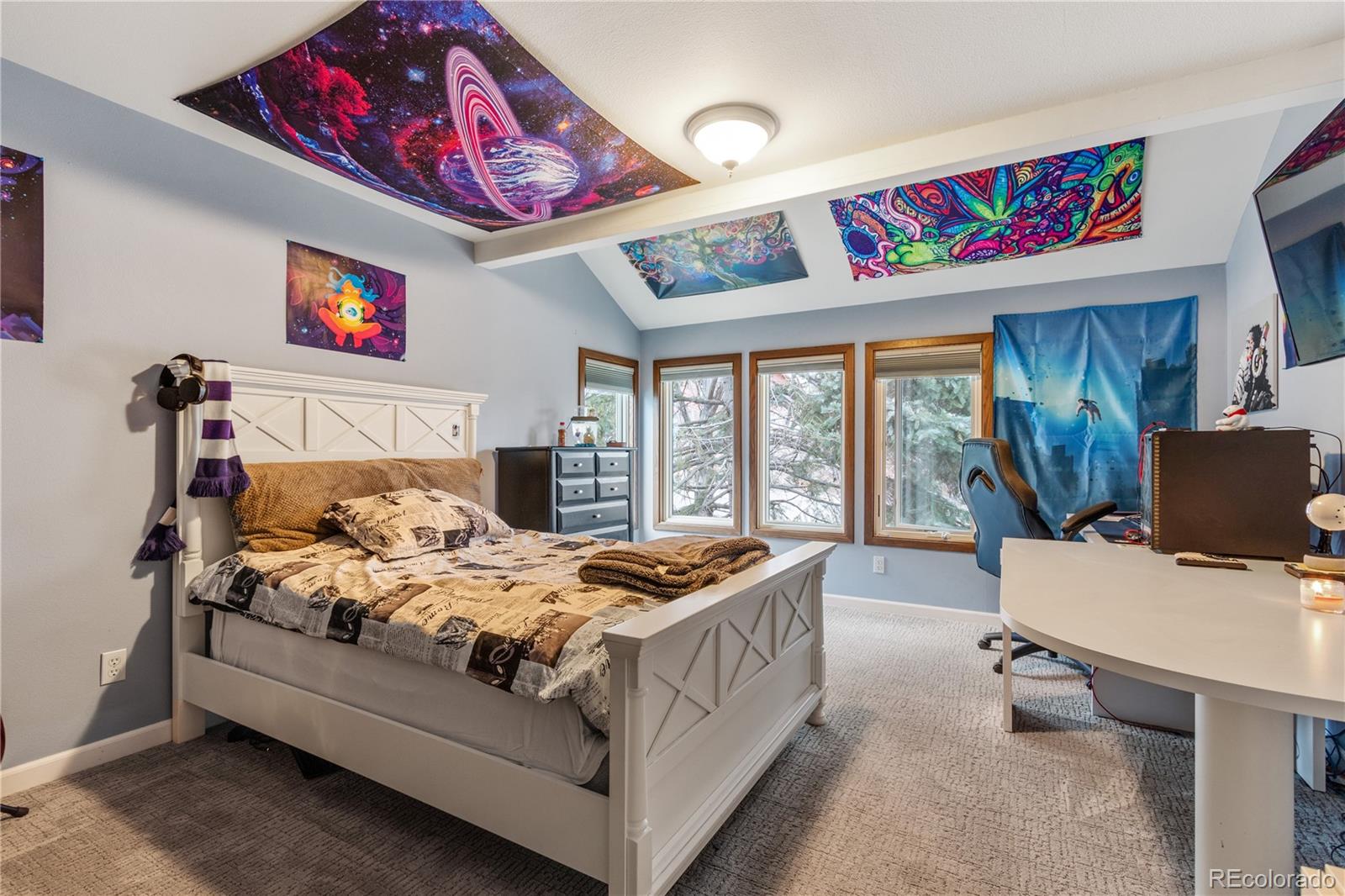 6674 Fairways Drive Longmont, CO 80503 - Photo 23 of 40 a bed room with a bed and a chair