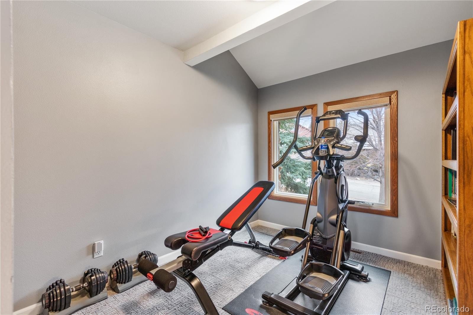 6674 Fairways Drive Longmont, CO 80503 - Photo 25 of 40 a room with gym equipment and a mirror
