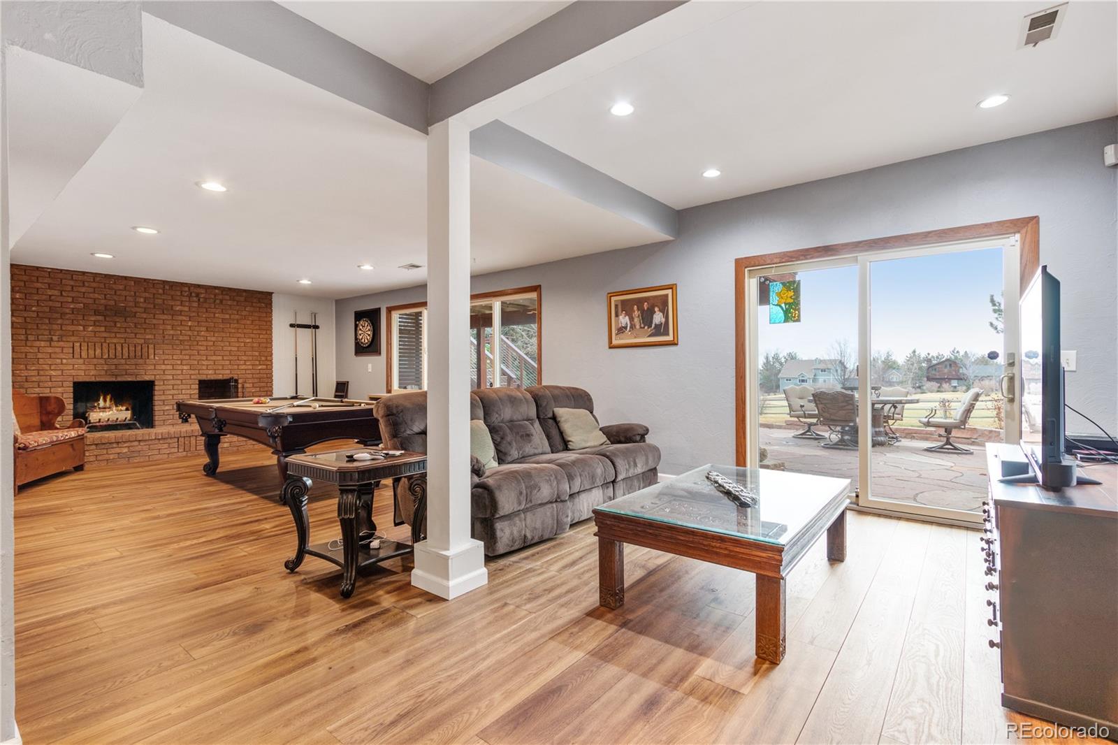 6674 Fairways Drive Longmont, CO 80503 - Photo 26 of 40 a living room with furniture and a wooden floor