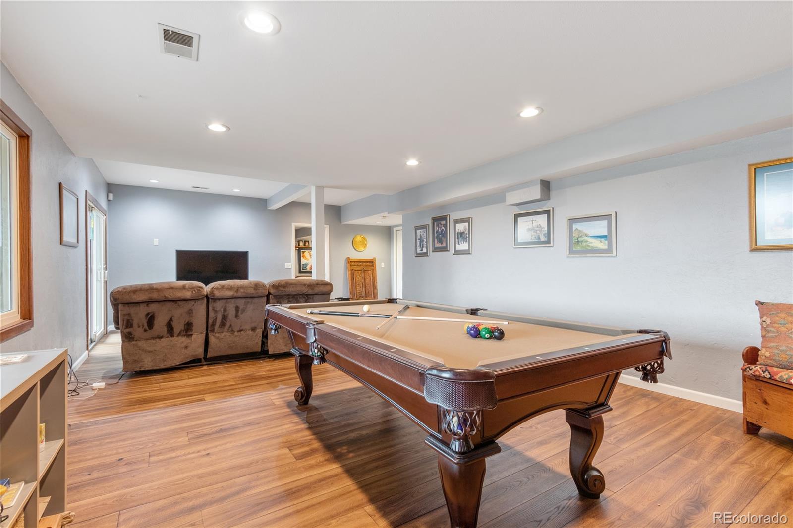 6674 Fairways Drive Longmont, CO 80503 - Photo 28 of 40 a living room with a table and a refrigerator