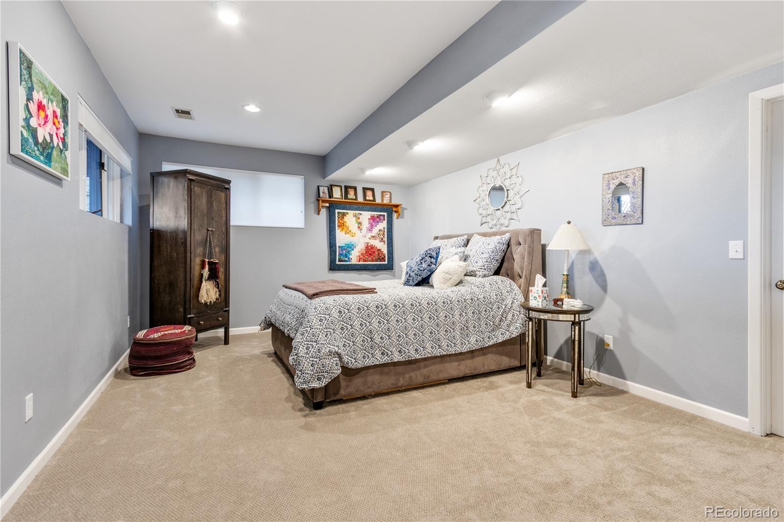 6674 Fairways Drive Longmont, CO 80503 - Photo 29 of 40 a bedroom with a bed and a window