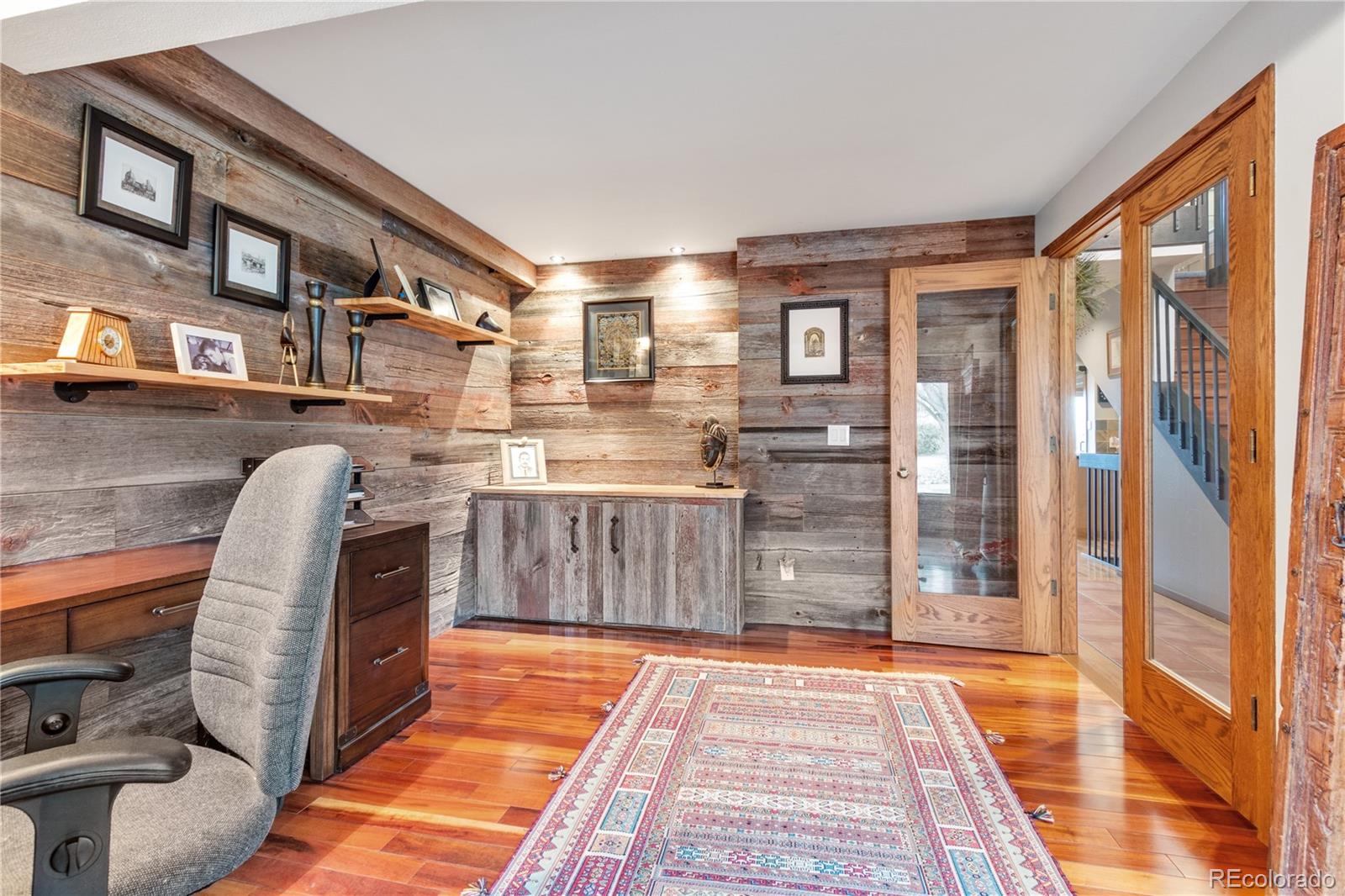 6674 Fairways Drive Longmont, CO 80503 - Photo 4 of 40 a room with lots of furniture and a rug