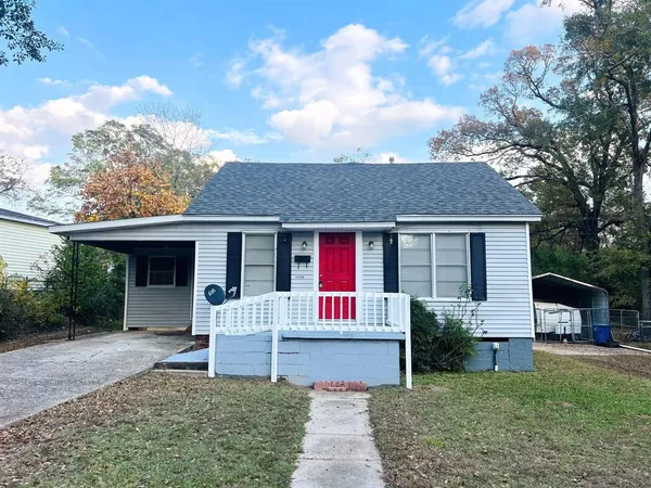 a front view of a house with a yard and porch