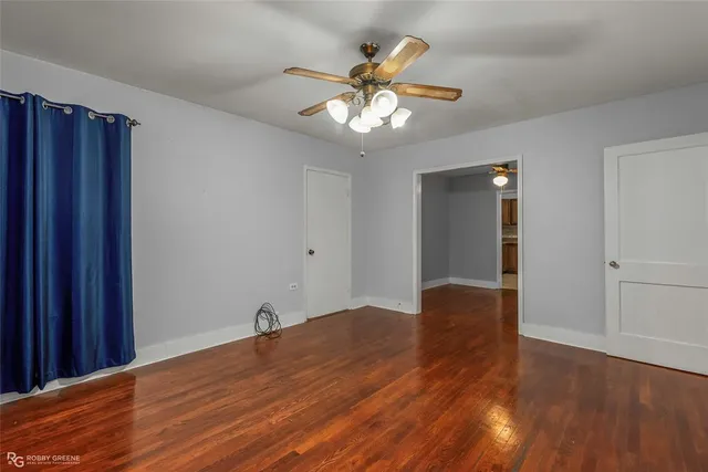 a view of a livingroom with a chandelier fan