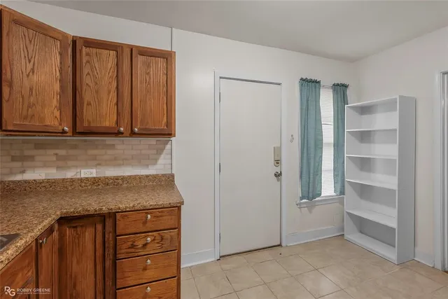 a view of cabinets and window