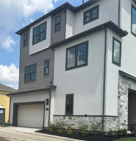 a front view of a house with garage