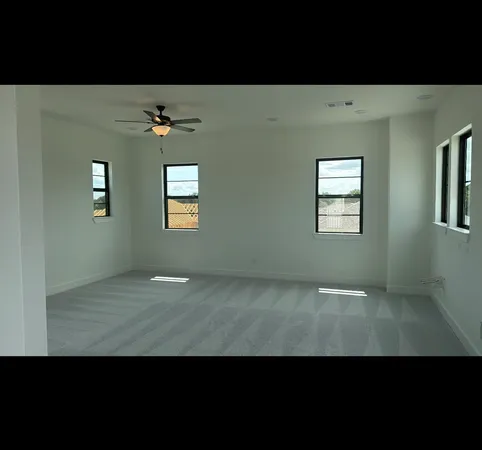 a bathroom with a granite countertop sink a mirror and shower