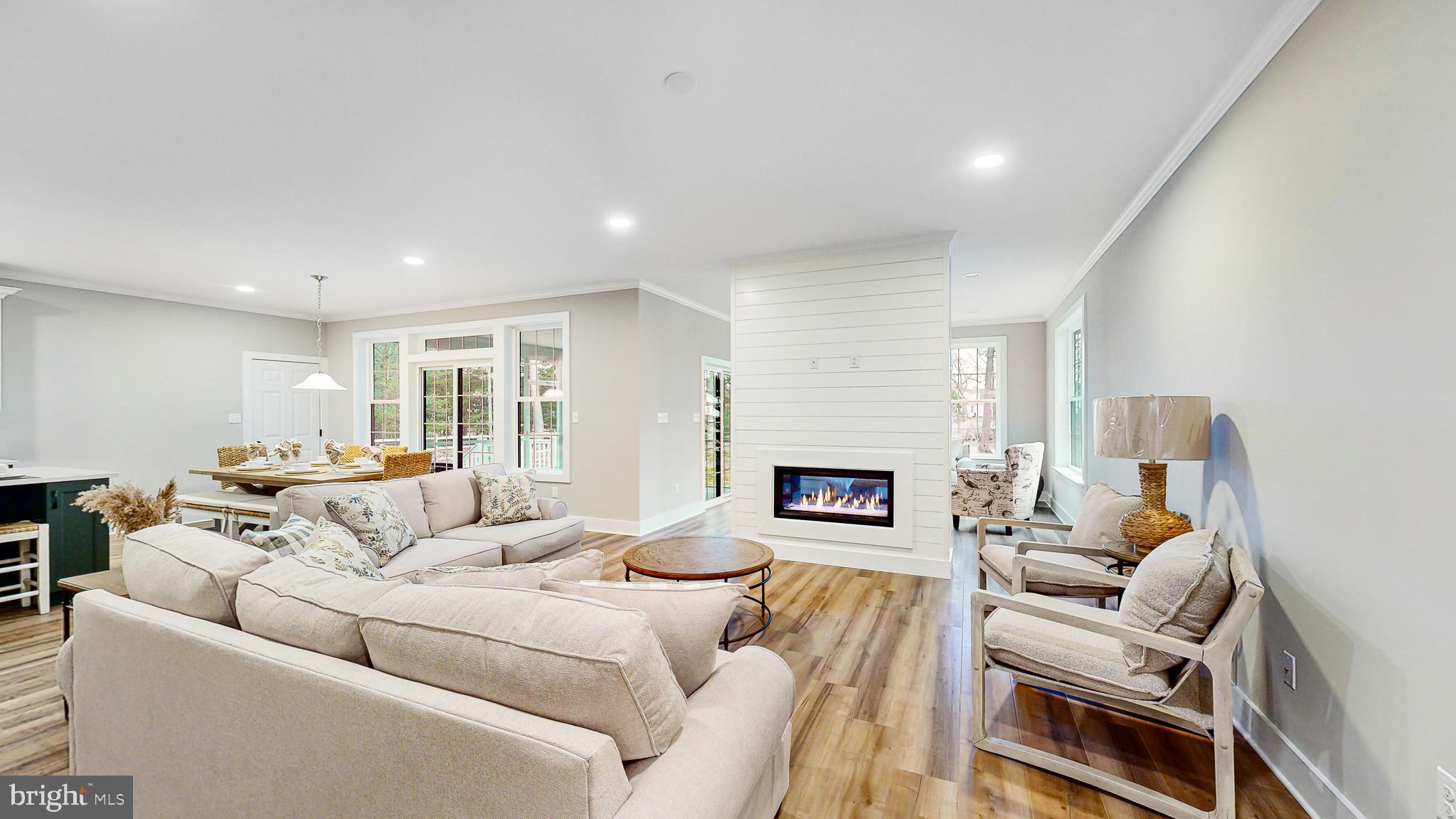 24558 Timber Branch Millsboro, DE 19966 - Photo 14 of 26 a living room with furniture and a fireplace