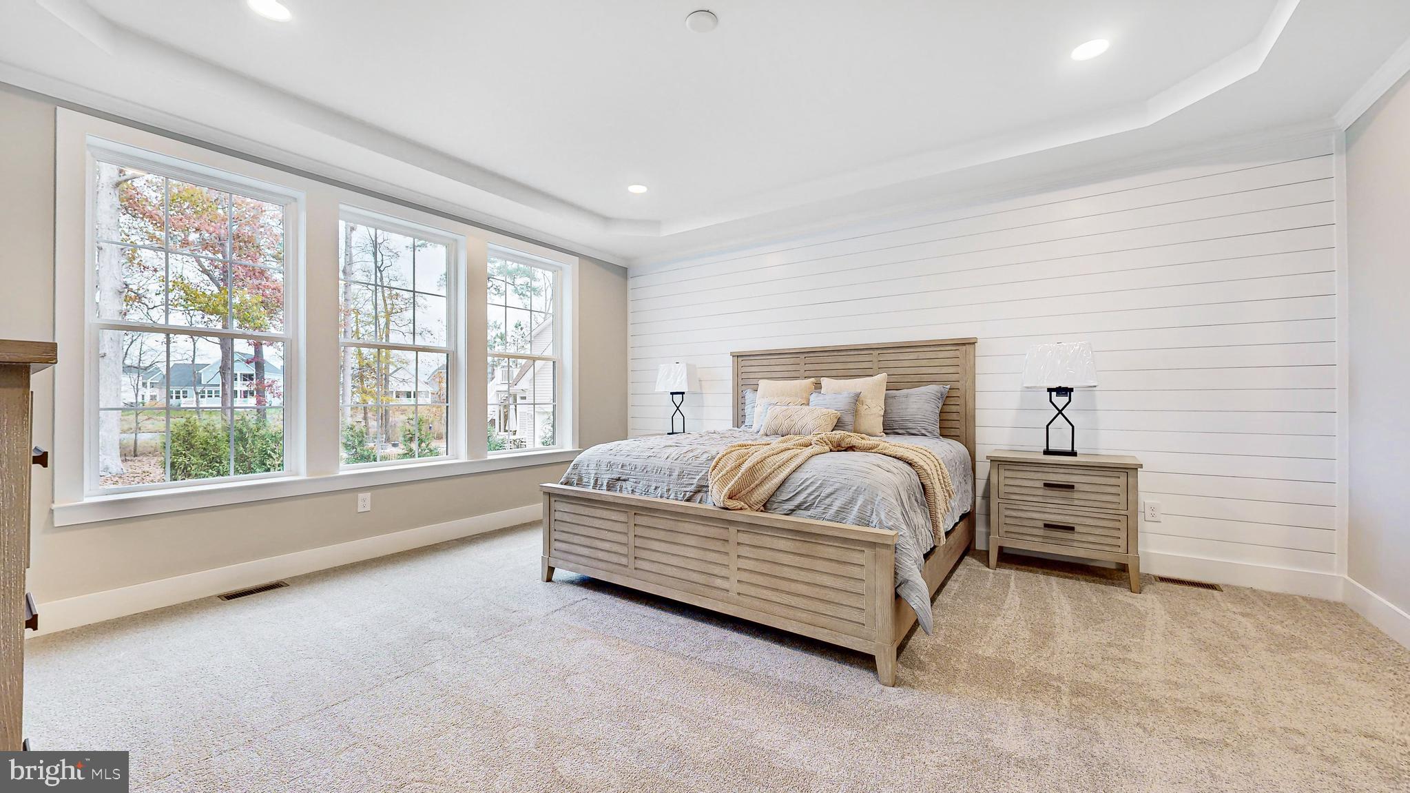 24558 Timber Branch Millsboro, DE 19966 - Photo 16 of 26 a bedroom with a bed and a large window