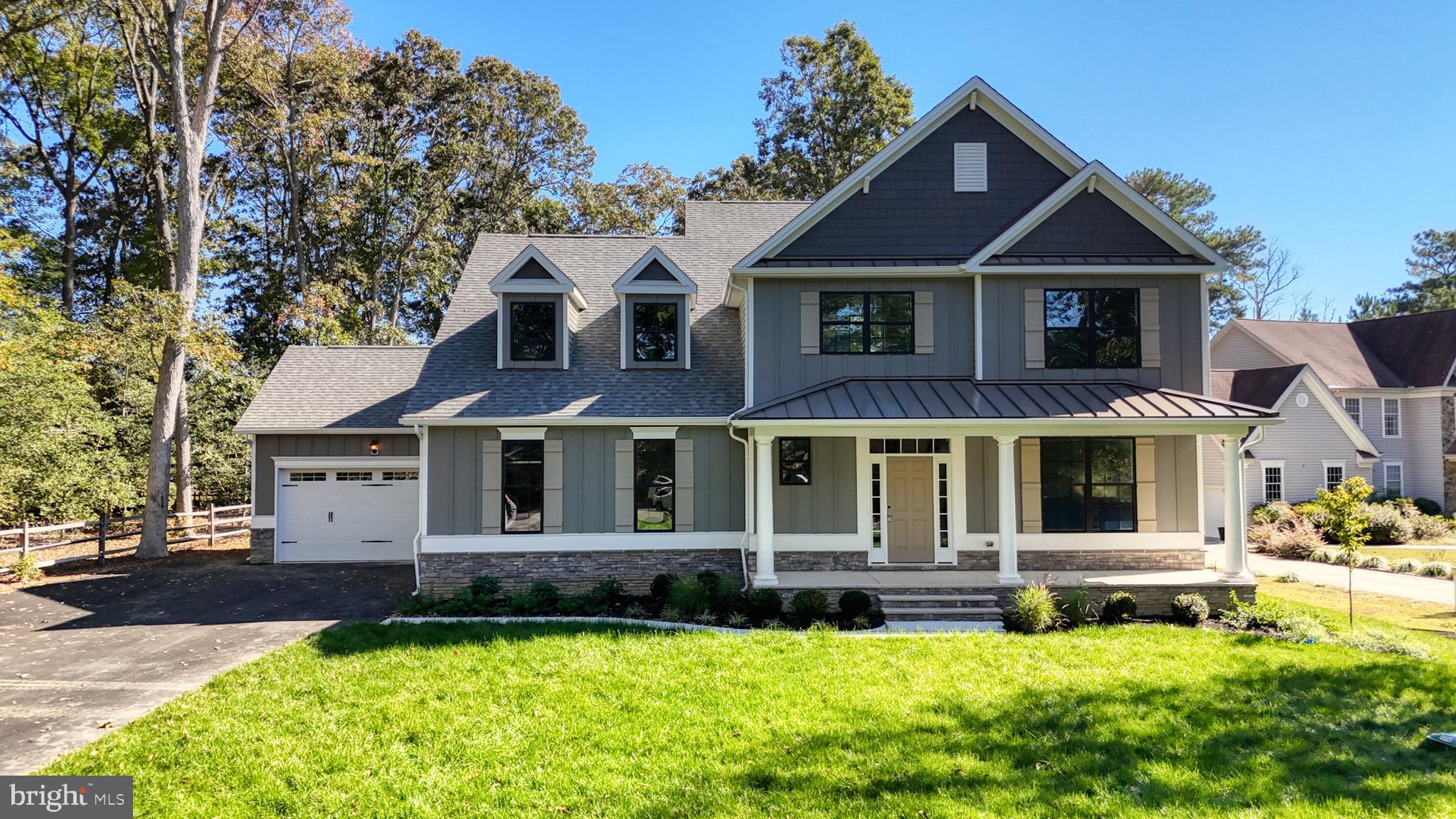 24558 Timber Branch Millsboro, DE 19966 - Photo 2 of 26 a front view of a house with a yard