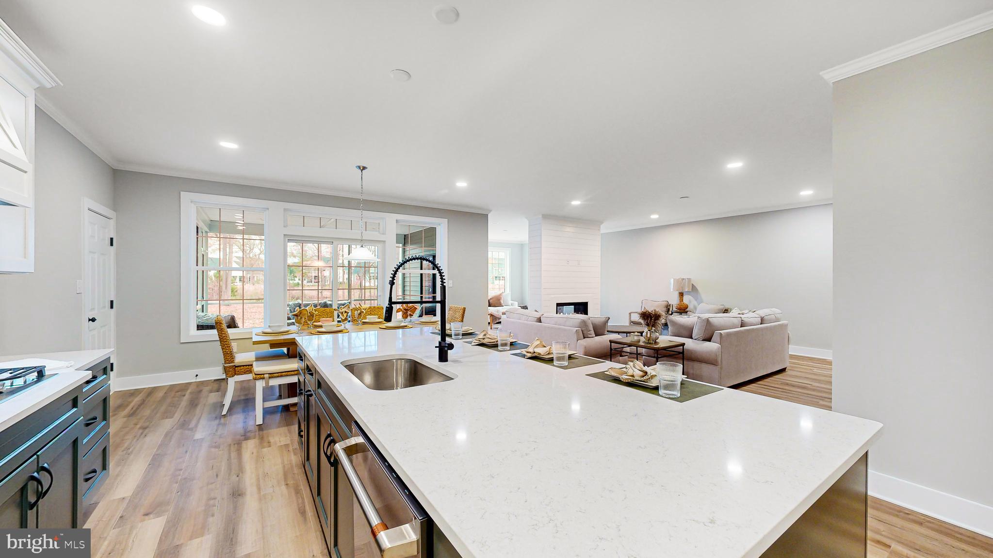 24558 Timber Branch Millsboro, DE 19966 - Photo 21 of 26 a view of a dining hall with furniture and wooden floor