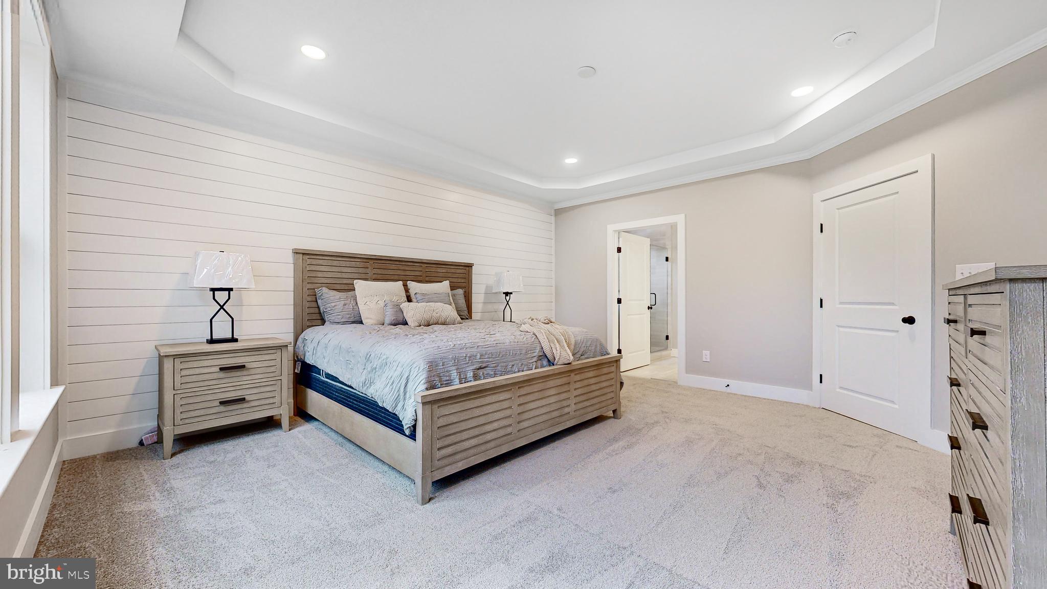 24558 Timber Branch Millsboro, DE 19966 - Photo 5 of 26 a bedroom with a bed and cabinets