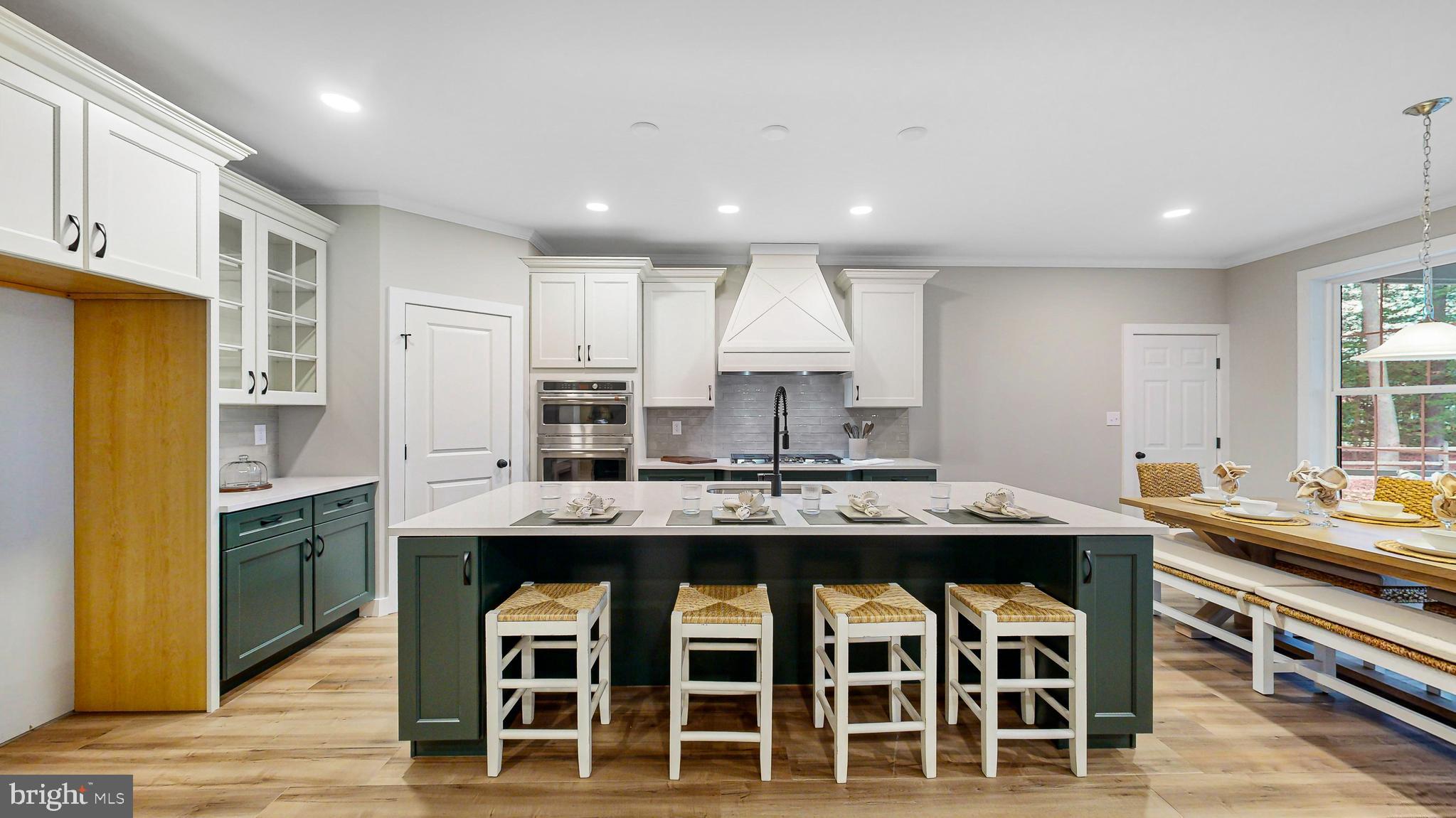 24558 Timber Branch Millsboro, DE 19966 - Photo 7 of 26 a kitchen with stainless steel appliances granite countertop a stove and a refrigerator