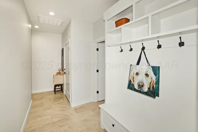 a view of an entryway with wooden floor