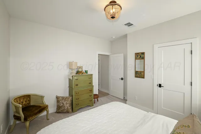 a bedroom with a bed and furniture