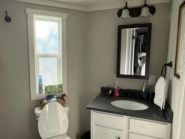 a view of a house with backyard and porch