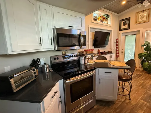 a view of an empty room with a fireplace